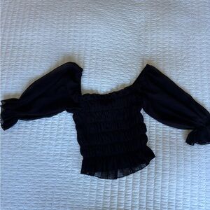 Black urban outfitters going out top. Can be worn off shoulder or on.
